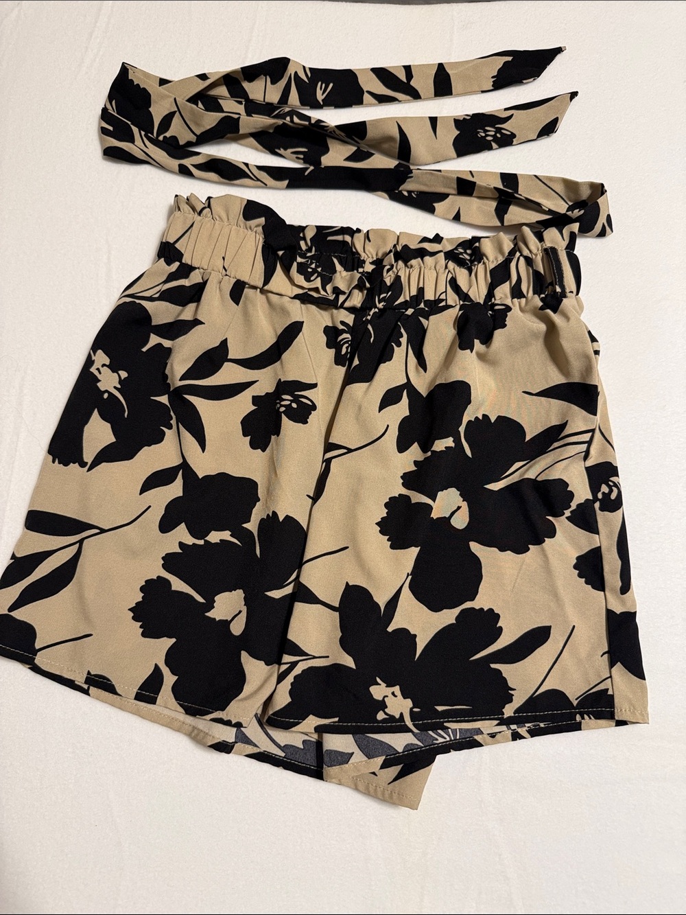 SHEIN Black Floral High-Waist Paperbag Shorts on Tan-s4